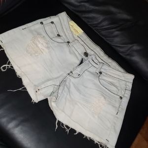 Machine distressed light blue wash denim shorts